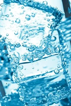 Ice cube in water bubbles Stock Photos