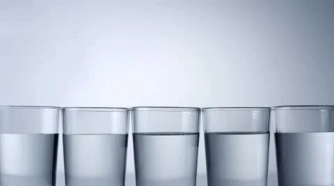 Ice cube in water, Slow Motion Stock Footage 9304343