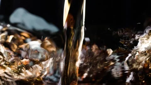 Ice cube whiskey rum close-up Stock Footage 259614323