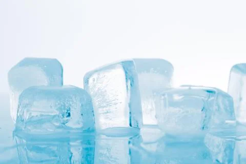 Ice cube on white background Stock Photos