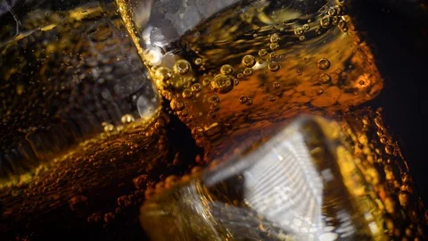 Ice Cubes And Bubbles Inside The Soda Video stock 103838633
