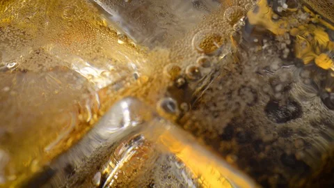 Ice Cubes And Bubbles Inside The Soda Video stock 103841938