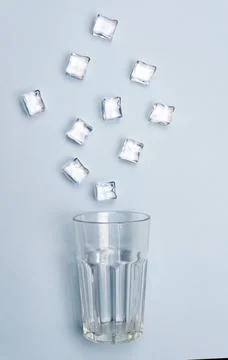 Ice cubes and stack on a blue background isolated. Clean water creative. Minimal 스톡 사진