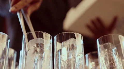 Ice Cubes Being Added To Glasses With Silver Tongs Stock Footage 266840266