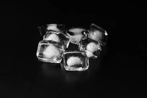 Ice cubes on black background, copy space Stock Photos