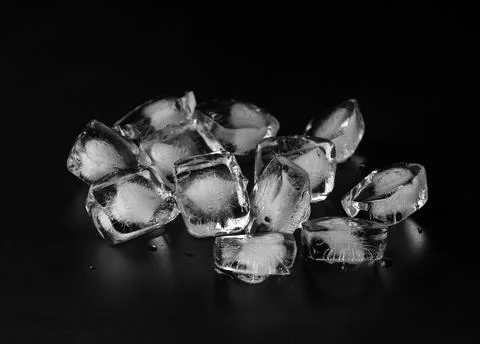 Ice cubes on black background Stock Photos