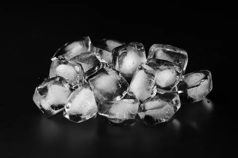 Ice cubes on black background Stock Photos