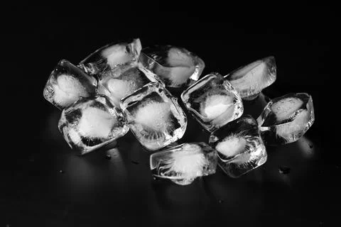 Ice cubes on black background Stock Photos