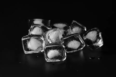 Ice cubes on black background Stock Photos