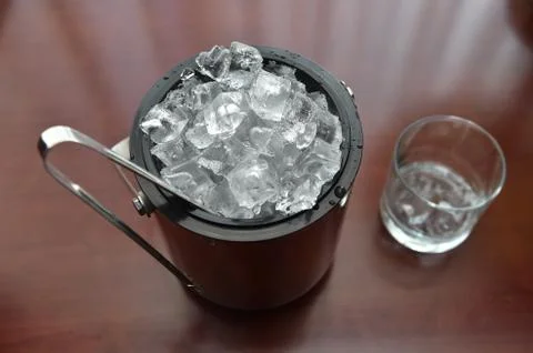 Ice cubes in the bucket Stock Photos