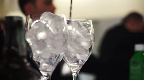 Ice cubes in cocktail glasses 스톡 동영상 68739870