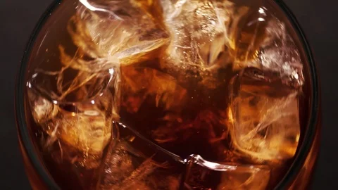 Ice cubes in Cola closeup Top view Stock Footage 124796558