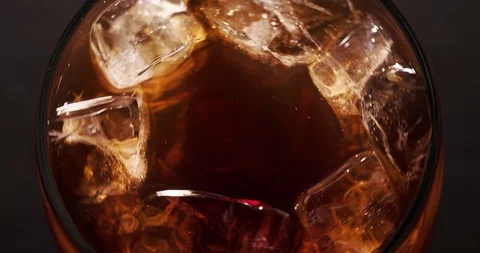 Ice cubes in Cola Macro closeup Top view Stock Footage 124797251