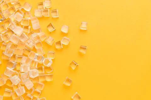 Ice cubes, cold on a yellow background 스톡 사진