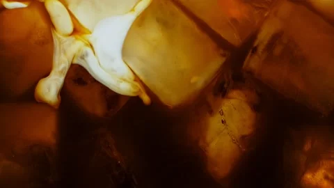 Ice Cubes with Cream Coffee, Macro Shot. Stock Footage 133461541