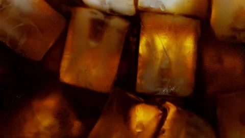 Ice Cubes with Cream Coffee, Macro Shot. Stock Footage