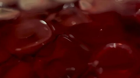 Ice cubes in a drink. Close-up Stock Footage 77258924