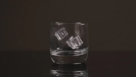 Ice Cubes Fall Into Glass Stock Footage 208787198