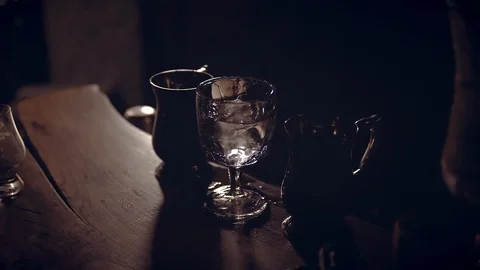 Ice cubes fall into a glass. Slow motion, drops of water. Stock Footage 124242203