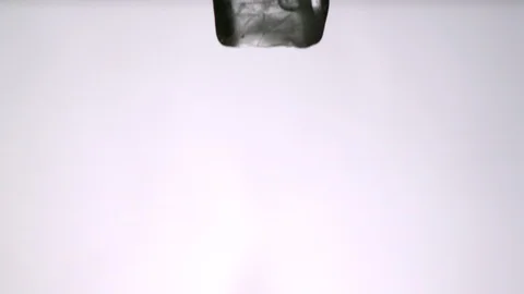 Ice Cubes falling and splitting into white background Video stock 104639216