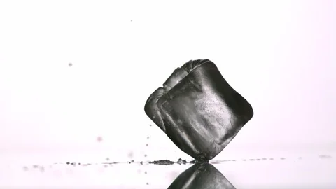 Ice Cubes falling, breaking up into white background Video stock 104633283