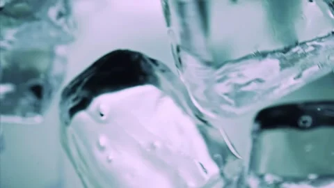 Ice cubes falling down in glass, macro extreme close up. Super slow motion 1000 Stock Footage 255196620