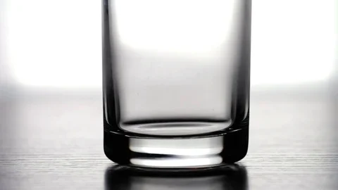 Ice Cubes Falling Into Glass 2 Stock Footage 75931820