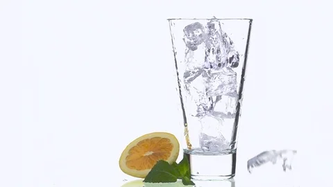 Ice Cubes Falling into the Glass. Stock Footage 76000032