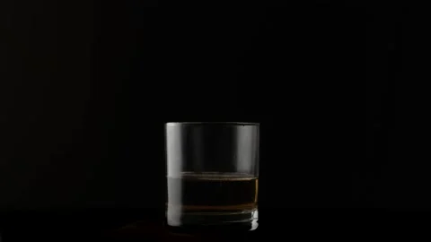 Ice cubes falling in glass Stock Footage 131381264