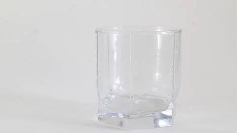 Ice Cubes falling Into a glass. Stock Footage 132259015