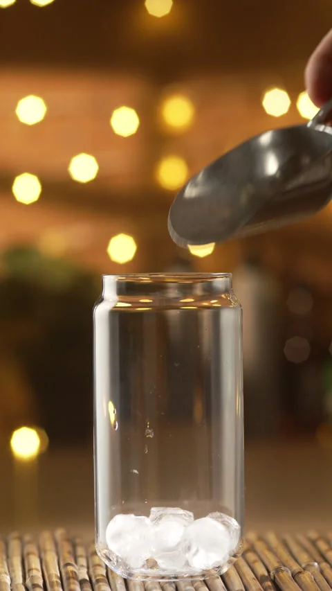 Ice Cubes Falling Into Glass Jar For Cocktail Stock Footage 337725479