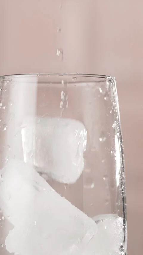 Ice Cubes Falling into Glass, slow motion. Stock Footage 311004058