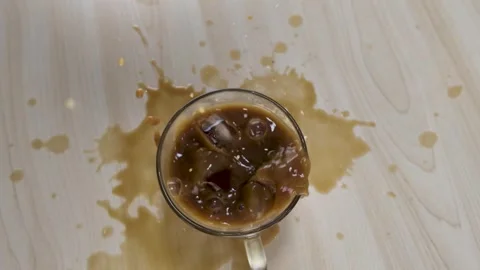 Ice Cubes Falling into Iced Coffee Cup with Splash Video stock 341733306