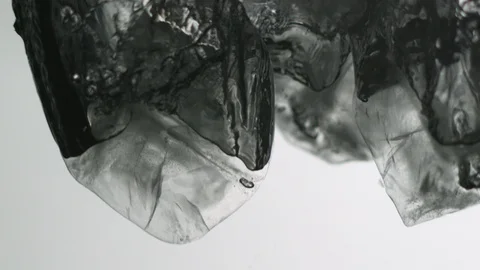 Ice cubes falling into water Video stock 104644747