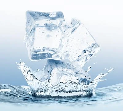Ice cubes falling into water on light blue gradient background Foto stock