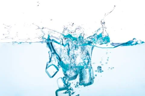 Ice cubes falling in the water With splattered water Is the concept of refres Stock Photos