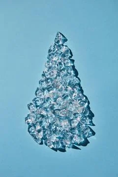  Ice cubes in the form of a drop on a blue background. Flat lay Refreshing... Stock Photos
