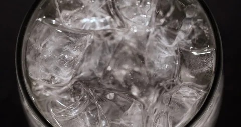 Ice cubes in Glass beverage Macro closeup Top view Stock Footage 125373731