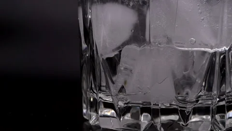 Ice cubes in a glass on a black background. Stock Footage 149432748