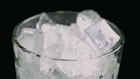 Ice Cubes in Glass on Black Background, Close Up Stock Footage 346086129