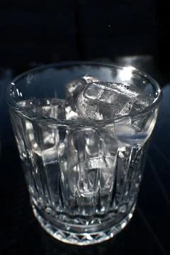 Ice cubes in a glass. Close up. Selective focus. Stock Photos