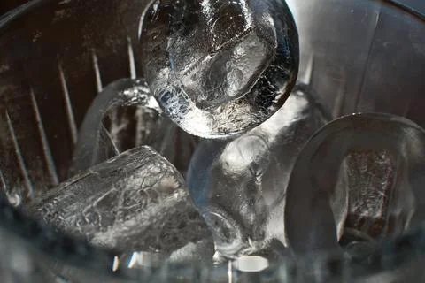 Ice cubes in a glass. Close up. Selective focus. Stock Photos