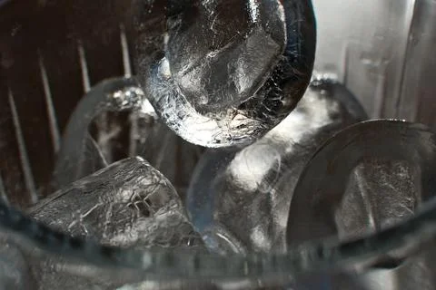 Ice cubes in a glass. Close up. Selective focus. Stock Photos