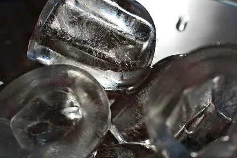 Ice cubes in a glass. Close up. Selective focus. Stock Photos