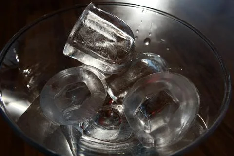 Ice cubes in a glass. Close up. Selective focus. Stock Photos