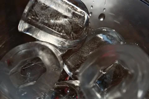 Ice cubes in a glass. Close up. Selective focus. Stock Photos