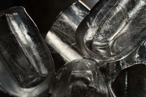 Ice cubes in a glass. Close up. Selective focus. Stock Photos