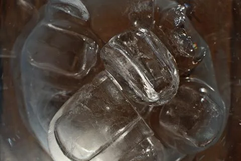 Ice cubes in a glass. Close up. Selective focus. Stock Photos
