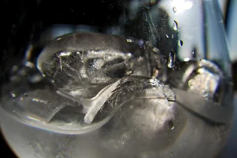 Ice cubes in a glass. Close up. Selective focus. Stock Photos