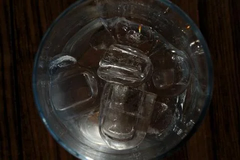 Ice cubes in a glass. Close up. Selective focus. Stock Photos